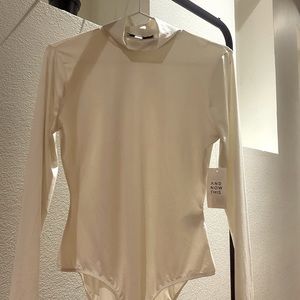 Shiny cream body suit! It’s super soft too